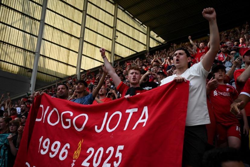 Fans remember Liverpool's late Portuguese striker #20 Diogo Jota following the pre-season friendly football match between Preston North End and Liverpool at Deepdale stadium in Preston, north-west England on July 13, 2025. Liverpool are to retire Diogo Jota's number 20 shirt in honour of the Portugal forward who was killed in a car crash this month. The club return to action for the first time since the July 3 tragedy at English Championship side Preston today. Oli SCARFF / AFP