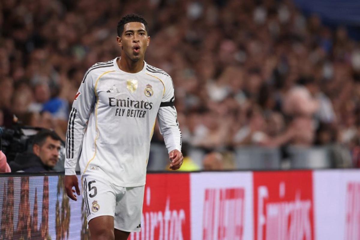 Real Madrid's English midfielder #05 Jude Bellingham reacts during the Spanish League football match between Real Madrid CF and Valencia CF at Santiago Bernabeu Stadium in Madrid on November 1, 2025.  Oscar DEL POZO / AFP