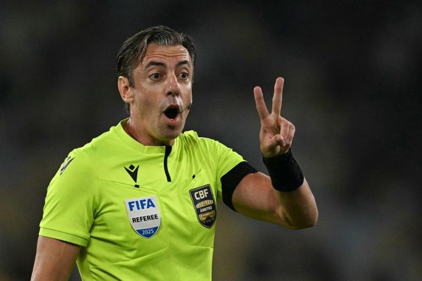 Brazilian referee Raphael Claus gestures during the Brasileirao Serie A football match between Vasco da Gama and Fluminense at the Maracana Stadium in Rio de Janeiro, Brazil, on March 18, 2026.  MAURO PIMENTEL / AFP