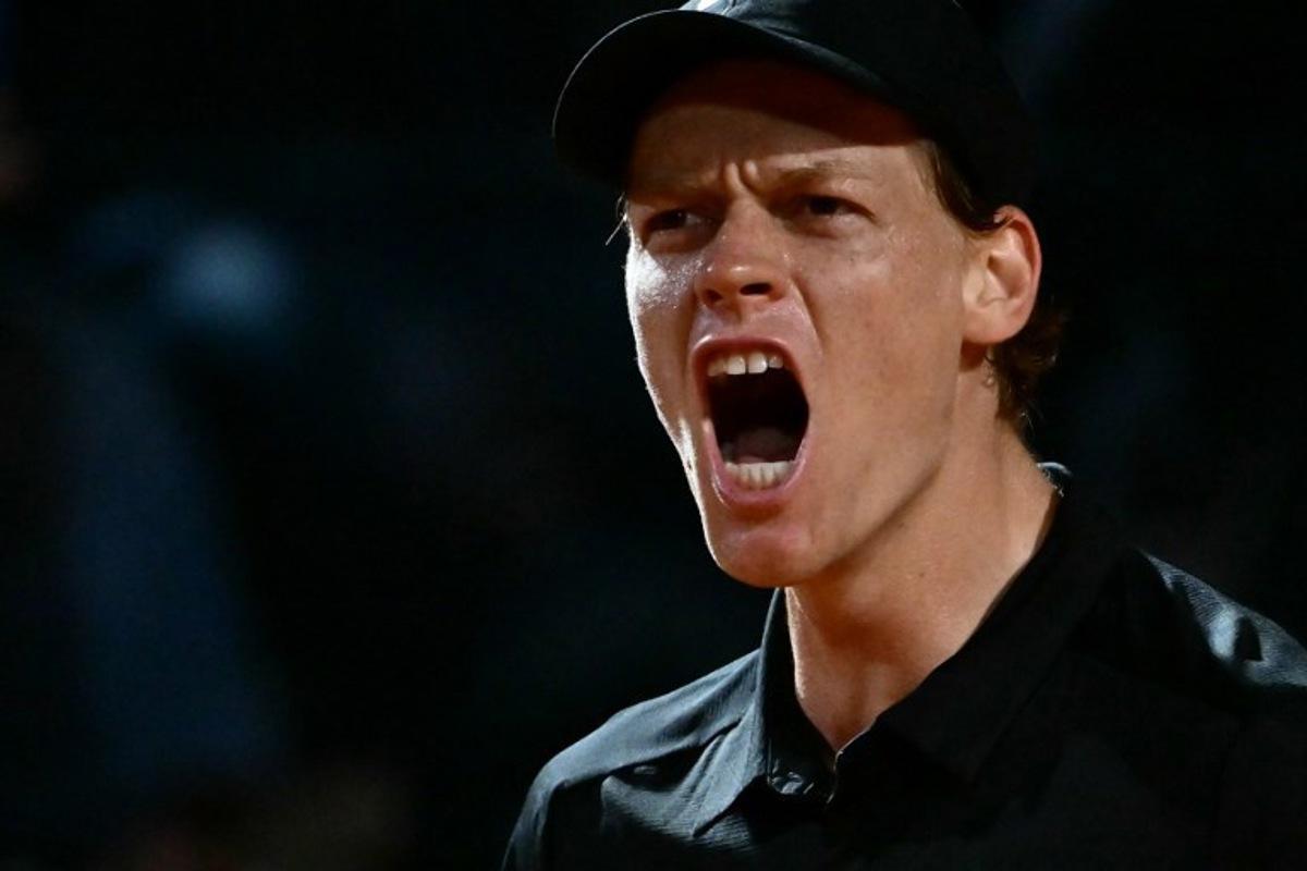 Italy's Jannik Sinner celebrates a point against Russia's Daniil Medvedev during their semi-final at the ATP Rome Open tennis tournament at Foro Italico in Rome on May 15, 2026.   Filippo MONTEFORTE / AFP