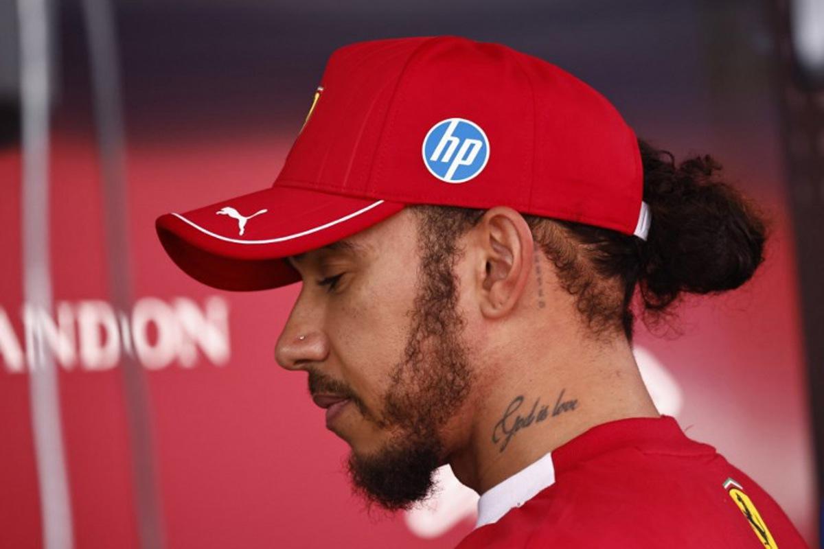 Ferrari's British driver Lewis Hamilton looks on after the Sprint Race of the Formula One Belgian Grand Prix at the Spa-Francorchamps circuit in Spa, on July 26, 2025.  SIMON WOHLFAHRT / AFP