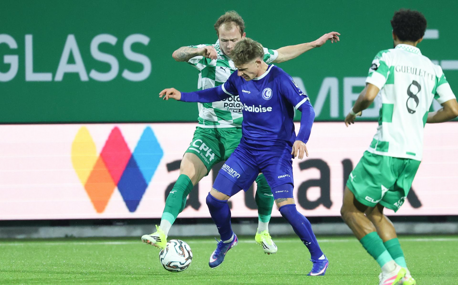 RAAL's Nolan Gillot and Gent's Michal Skoras fight for the ball during a soccer match between RAAL La Louviere and KAA Gent, Friday 30 January 2026 in La Louviere, on day 23 of the 2025-2026 'Jupiler Pro League' first division of the Belgian championship. BELGA PHOTO VIRGINIE LEFOUR