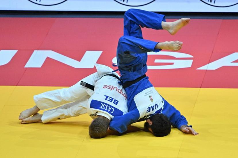 Belgium's Matthias Casse competes against United Arab Emirates' Gadzhimurad Omarov (blue) in the men's -81kg qualification round of the Judo World Championships at Papp Laszlo Arena in Budapest, Hungary, on June 16, 2025.    Attila KISBENEDEK / AFP