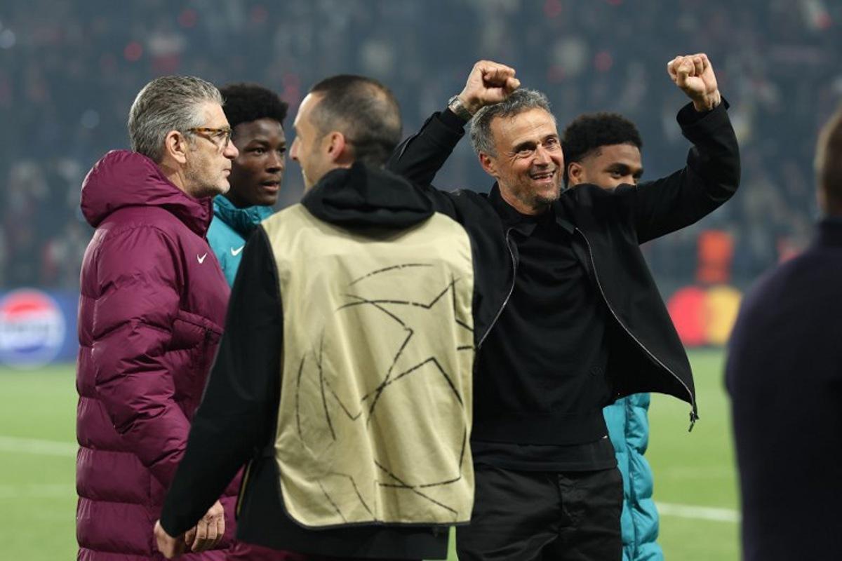 Paris Saint-Germain's Spanish coach Luis Enrique (R) celebrates his team's victory at the end of the UEFA Champions League semi-final second leg football match between Paris Saint-Germain (PSG) and Arsenal at the Parc des Princes stadium in Paris, on May 7, 2025.  FRANCK FIFE / AFP