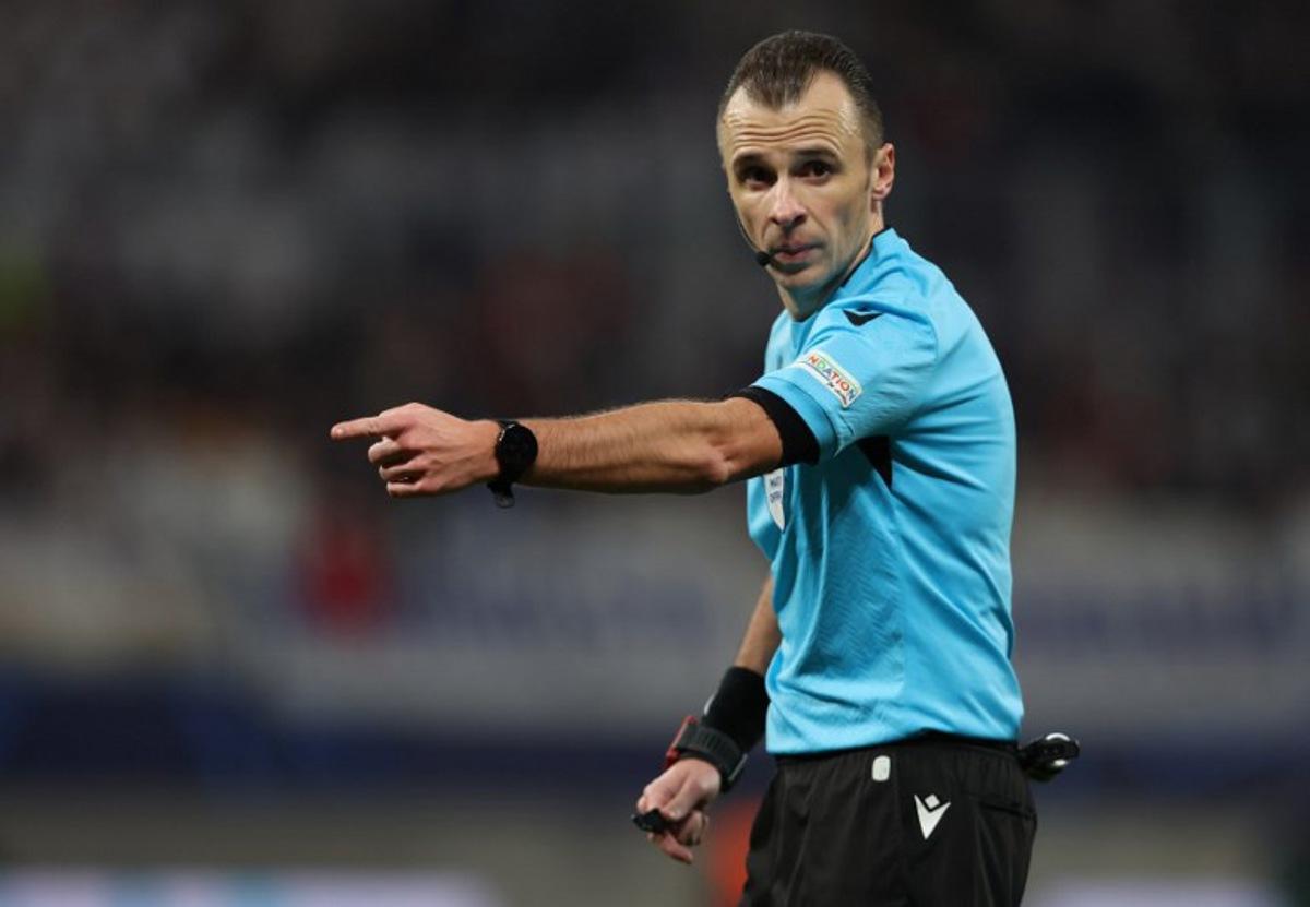 Bosnian Herzegovian referee Irfan Peljto gestures during the UEFA Champions League Round of 16, first-leg football match between RB Leipzig and Real Madrid CF in Leipzig, eastern Germany, on February 13, 2024.  Ronny HARTMANN / AFP