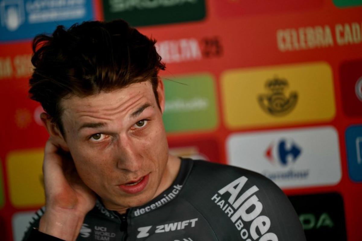 Team Alpecin's Belgian rider Jasper Philipsen looks on after winning the first stage of the Vuelta a Espana, a 183 km race between Torino - Reggia di Venaria and Novara, in Italy's Piemonte region, on August 23, 2025.    Marco BERTORELLO / AFP