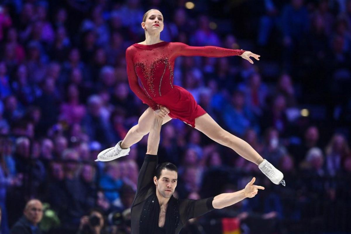 Germany's Minerva Fabienne Hase and Nikita Volodin perform during the pairs short program of the 2026 ISU Figure Skating World Championships in Prague on March 25, 2026.  Michal Cizek / AFP