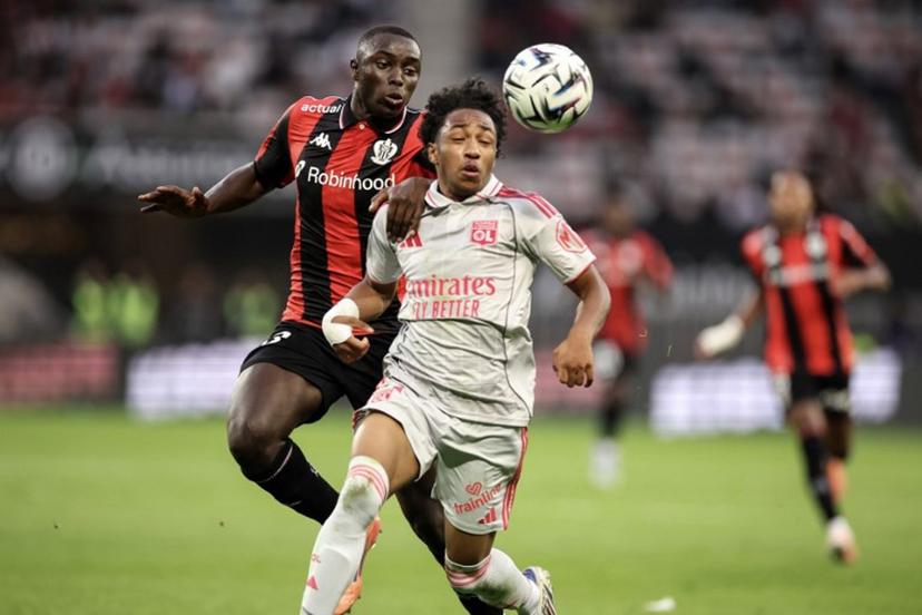 Nice' Senegalese defender #33 Antoine Mendy (L) fights for the ball with Lyon's Belgian forward #11 Malick Fofana (R) during the French L1 football match between OGC Nice and Olympique Lyonnais at the Allianz Riviera Stadium in Nice, south-eastern France on October 18, 2025.  Valery HACHE / AFP