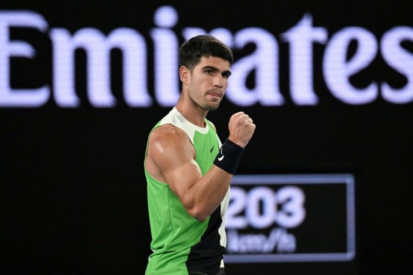 Spain's Carlos Alcaraz reacts after a point against Australia's Adam Walton during their men's singles match on day one of the Australian Open tennis tournament in Melbourne on January 18, 2026.  Paul Crock / AFP