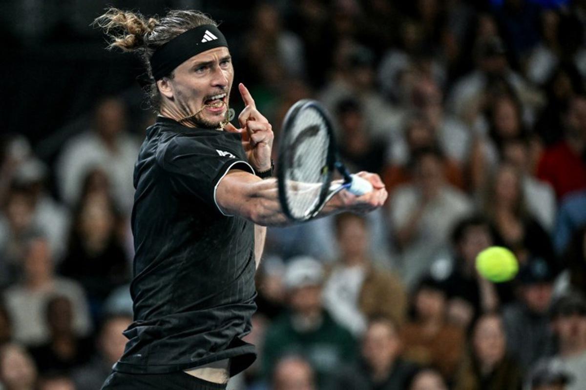 Germany's Alexander Zverev hits a return to France's Alexandre Muller during their men's singles match on day four of the Australian Open tennis tournament in Melbourne on January 21, 2026.  Paul Crock / AFP