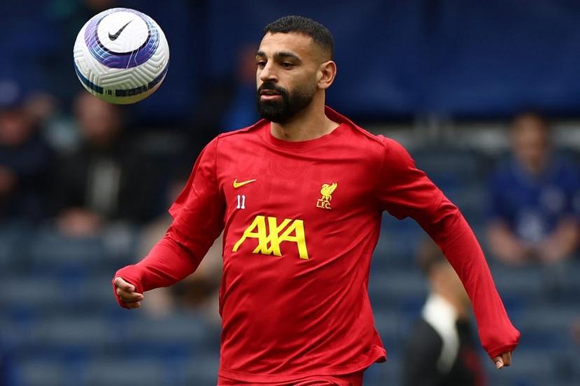 Liverpool's Egyptian striker #11 Mohamed Salah warms up ahead of the English Premier League football match between Chelsea and Liverpool at Stamford Bridge in London on May 4, 2025.  HENRY NICHOLLS / AFP