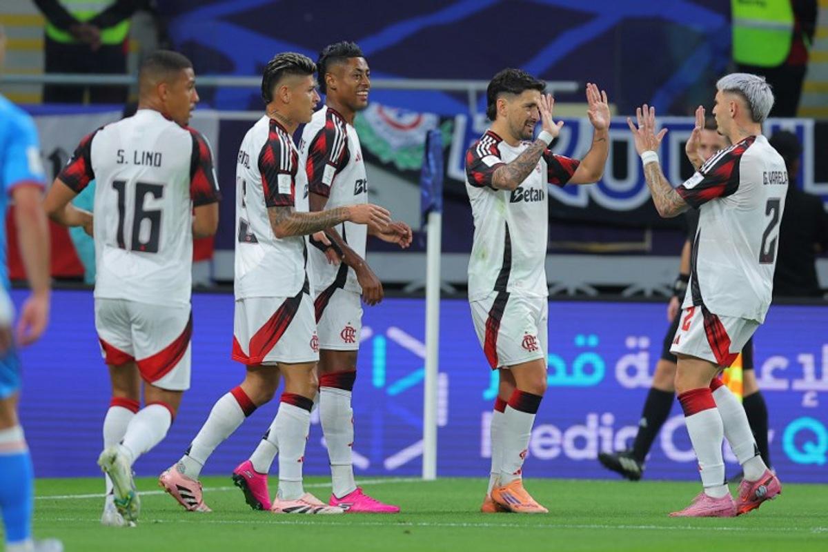 Flamengo's Giorgian de Arrascaeta #10 (2nd R) celebrates with teammates after scoring his team's first goal during the FIFA Derby of the Americas match between Cruz Azul and Flamengo at Ahmad Bin Ali Stadium in Doha on December 10, 2025.  Karim JAAFAR / AFP