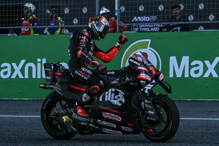Aprilia Racing's Italian rider Marco Bezzecchi celebrates his victory after crossing the finish line during the MotoGP Thailand Grand Prix at the Buriram International Circuit in Buriram on March 1, 2026.  Lillian SUWANRUMPHA / AFP