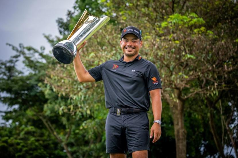 This handout photograph from the Asian Tour taken and received on October 26, 2025 shows Philippines' Miguel Tabuena posing with the trophy during the presentation ceremony, after winning the International Series Philippines golf tournament at Sta. Elena Golf Club in Santa Rosa, Laguna province.  Graham Uden / Asian Tour / AFP