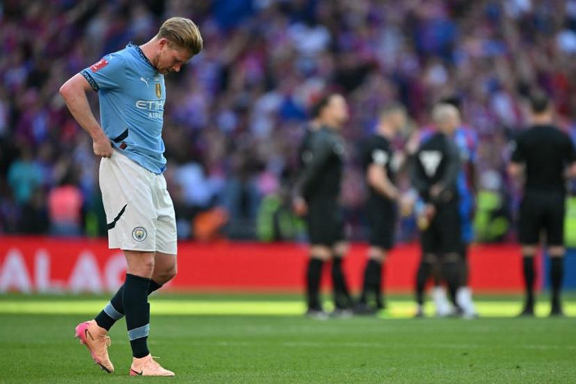 Manchester City's Belgian midfielder #17 Kevin De Bruyne reacts to their defeat on the pitch after the English FA Cup final football match between Crystal Palace and Manchester City at Wembley stadium in London, on May 17, 2025. Crystal Palace beat Manchester City 1-0 in the FA Cup final at Wembley on Saturday to win the first major trophy in the club's history. Glyn KIRK / AFP