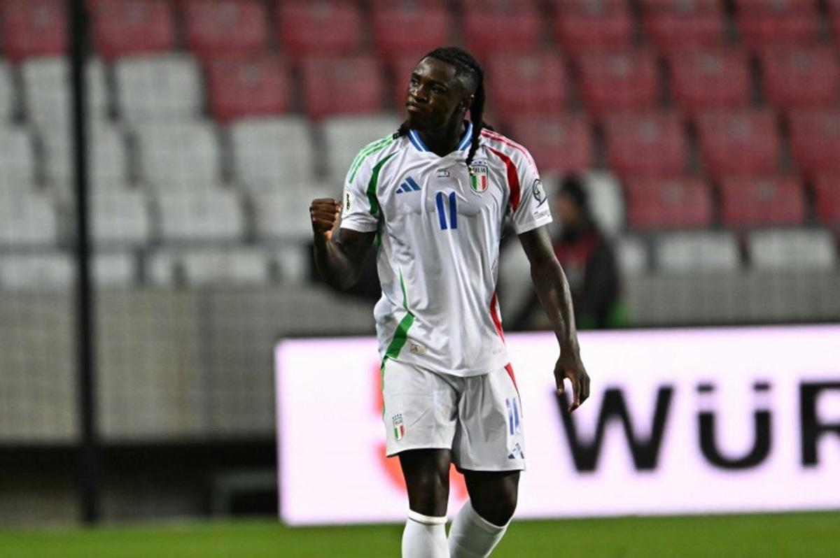 Italy's forward #11 Moise Kean celebrates after scoring the equalizing 1-1 goal during the 2026 World Cup qualifiers Europe zone group I football match between Israel and Italy on September 8, 2025 in Debrecen, Hungary.  Attila KISBENEDEK / AFP