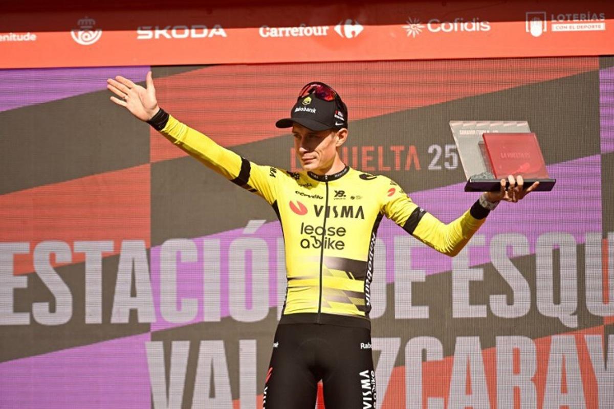 Team Visma-Lease a bike's Danish rider Jonas Vingegaard celebrates on stage after winning the 9th stage of the Vuelta a Espana, a 195 km race between Alfaro and Valdezcaray, on August 31, 2025.    ANDER GILLENEA / AFP