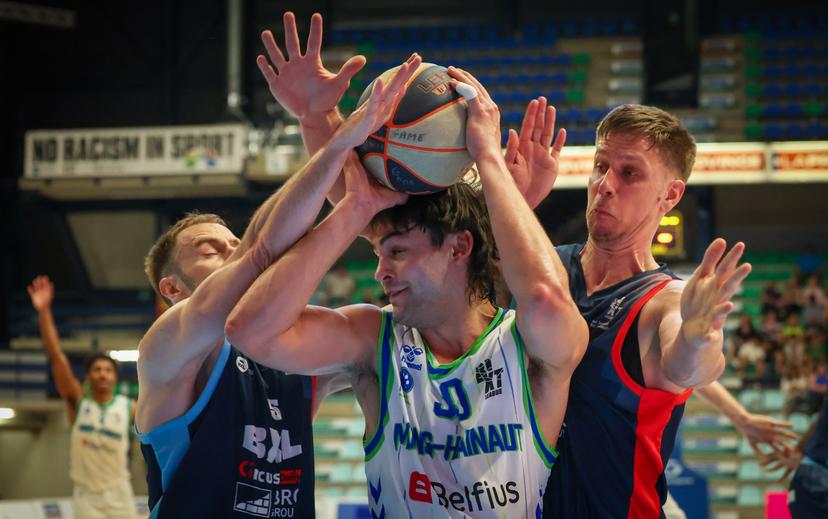 Brussels' Alexandre Libert, Mons' Brock Cunningham and Brussels' Yannick Desiron fight for the ball during a basketball match between Brussels Basketball and Mons-Hainaut, Wednesday 30 April 2025 in Brussels, on day 34 of the 'BNXT League' Belgian/ Dutch first division basket championship. BELGA PHOTO JOHN THYS