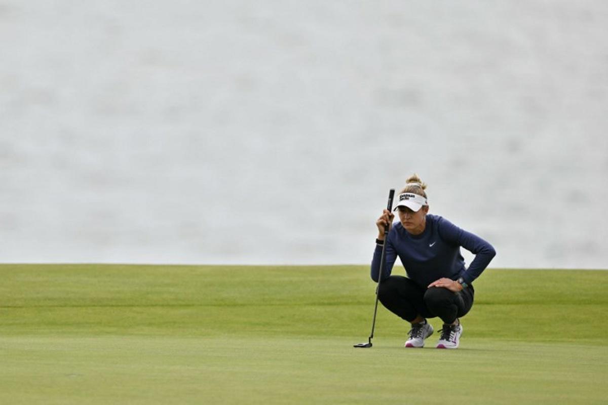 US player Nelly Korda lines up her put on the second green on day three of the Women's British Open Golf Championship, at Royal Porthcawl in south Wales on August 2, 2025.  Glyn KIRK / AFP