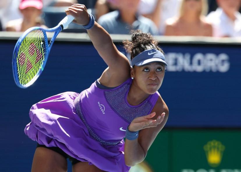 Japan's Naomi Osaka serves to Australia's Daria Kasatkina during their women's singles third round match on day seven of the US Open tennis tournament at the USTA Billie Jean King National Tennis Center in New York City, on August 30, 2025.  TIMOTHY A. CLARY / AFP