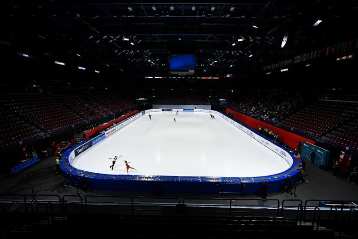 Athletes warm up before the Pair Skating - Free Skating program at the Milano Ice Skating arena (Unipol Forum) in Milan during the Skating - Road to 26 Trophy event, a Milano Cortina 2026 Winter Olympic Games test event, on February 20, 2025.  Piero CRUCIATTI / AFP
