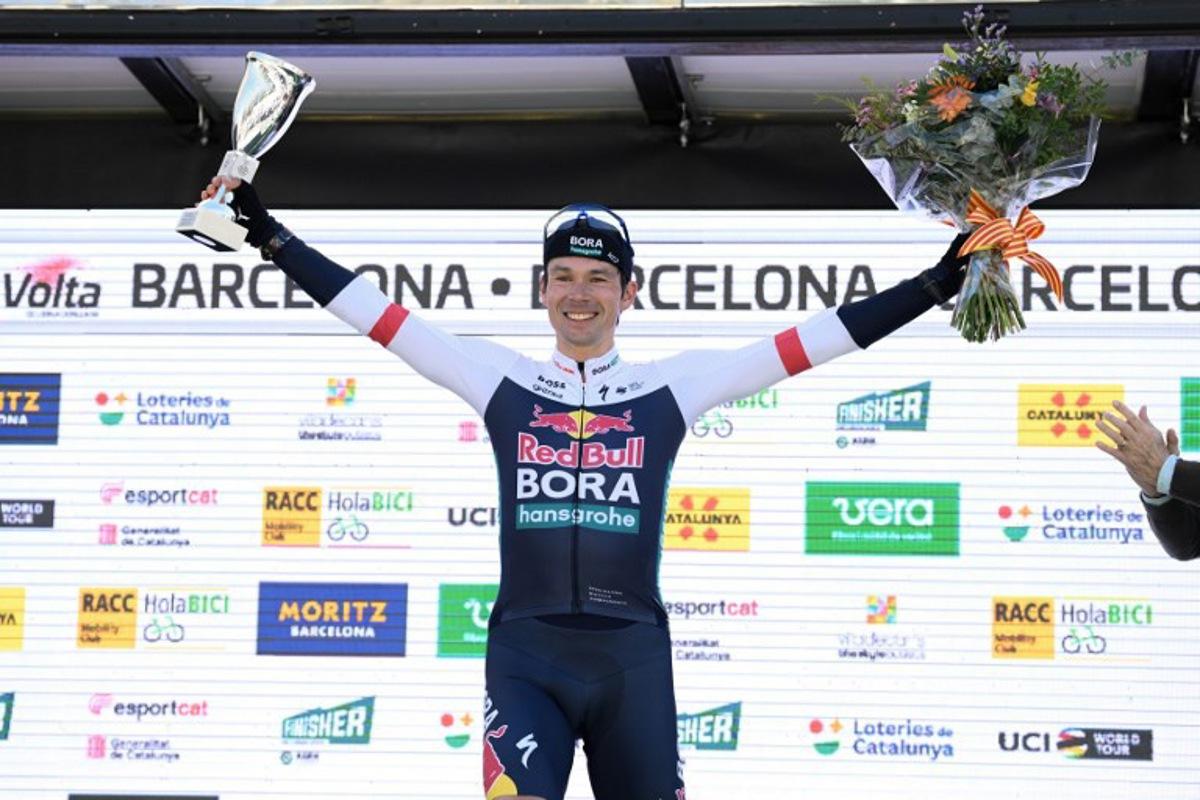 Team Bora's Primoz Roglic celebrates on the podium after winning the 2025 Volta a Catalunya cycling tour of Catalonia race, in Barcelona, on March 30, 2025. Roglic won the Vuelta a Catalunya on Sunday, soloing through the seventh and final stage in Barcelona, where his main rival Juan Ayuso (UAE) fell behind in the final. Roglic, who was a second behind Ayuso at the start of this final stage, broke away with 20 km to go and managed to maintain his lead to secure his second Volta a Catalunya victory. Josep LAGO / AFP