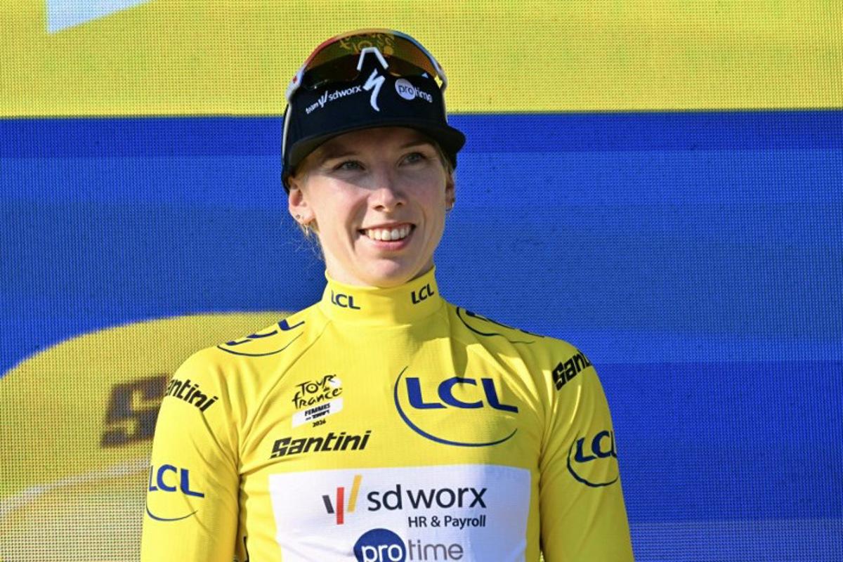 Yellow jersey of overall leader Team SD Worx-Protime's Dutch rider Lorena Wiebes poses on the podium after she won the first (out of 9) stage of the fifth edition of the Women's Tour de France cycling race, 138 km from Lausanne to Lausanne on August 1, 2026.   NICOLAS TUCAT / AFP
