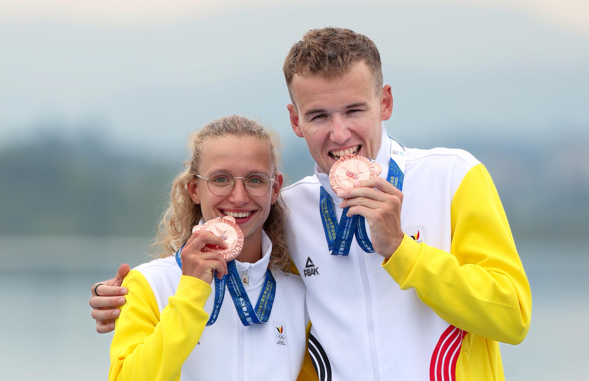 Belgian Jeanne Dupont and Belgian Arnaud Dely celebrates on the podium after winning bronze medal at the mixed duatlon event at the 2025 World Games, in Chenghdu, China, on Sunday 17 August 2025. This year, the World Games take place from 7 to 17 August. BELGA PHOTO VIRGINIE LEFOUR
