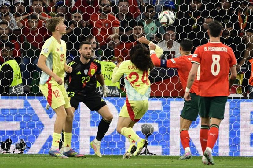Portugal's forward #07 Cristiano Ronaldo (2nd,R) scores the 2-2 equaliser during the UEFA Nations League final football match between Portugal and Spain in Munich, southern Germany on June 8, 2025.  John MACDOUGALL / AFP