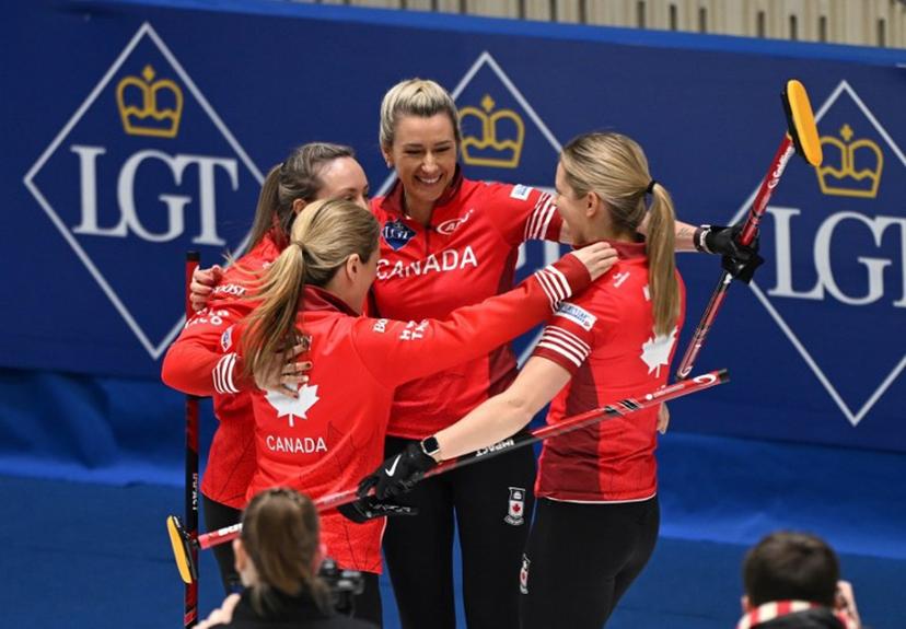 Canada's Rachel Homan (L) and her teammates celebrate their victory after the semi-final match between South Korea and Canada at the World Women's Curling Championship in Uijeongbu on March 22, 2025.   Jung Yeon-je / AFP