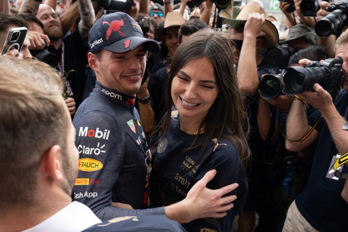 Red Bull Racing's Dutch driver Max Verstappen (C) hugs his girlfriend Kelly Piquet as the Red Bull Racing team celebrates winning the Constructors title and the Formula One United States Grand Prix, at the Circuit of the Americas in Austin, Texas, on October 23, 2022.  Jim WATSON / AFP