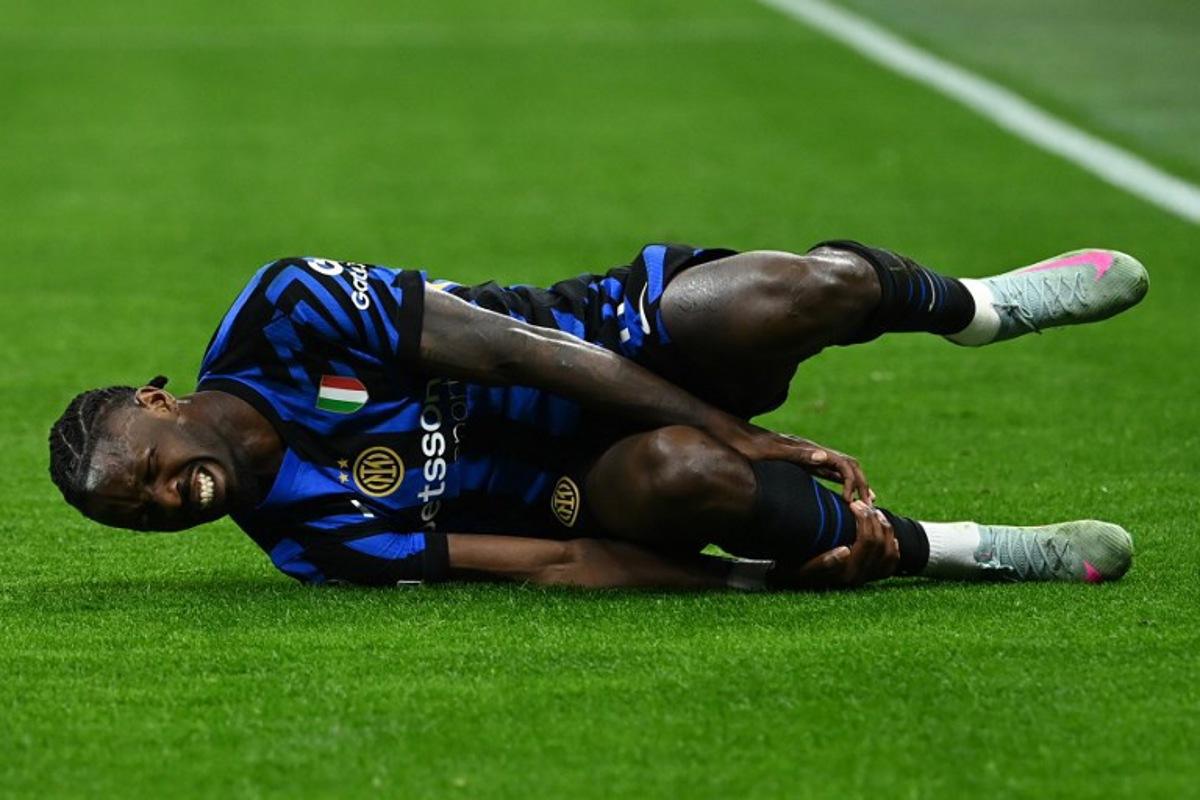 Inter Milan's French forward #09 Marcus Thuram reacts during the UEFA Champions League quarter final second leg football match between Inter Milan and Bayern Munich at the San Siro stadium in Milan on April 16, 2025.  Isabella BONOTTO / AFP