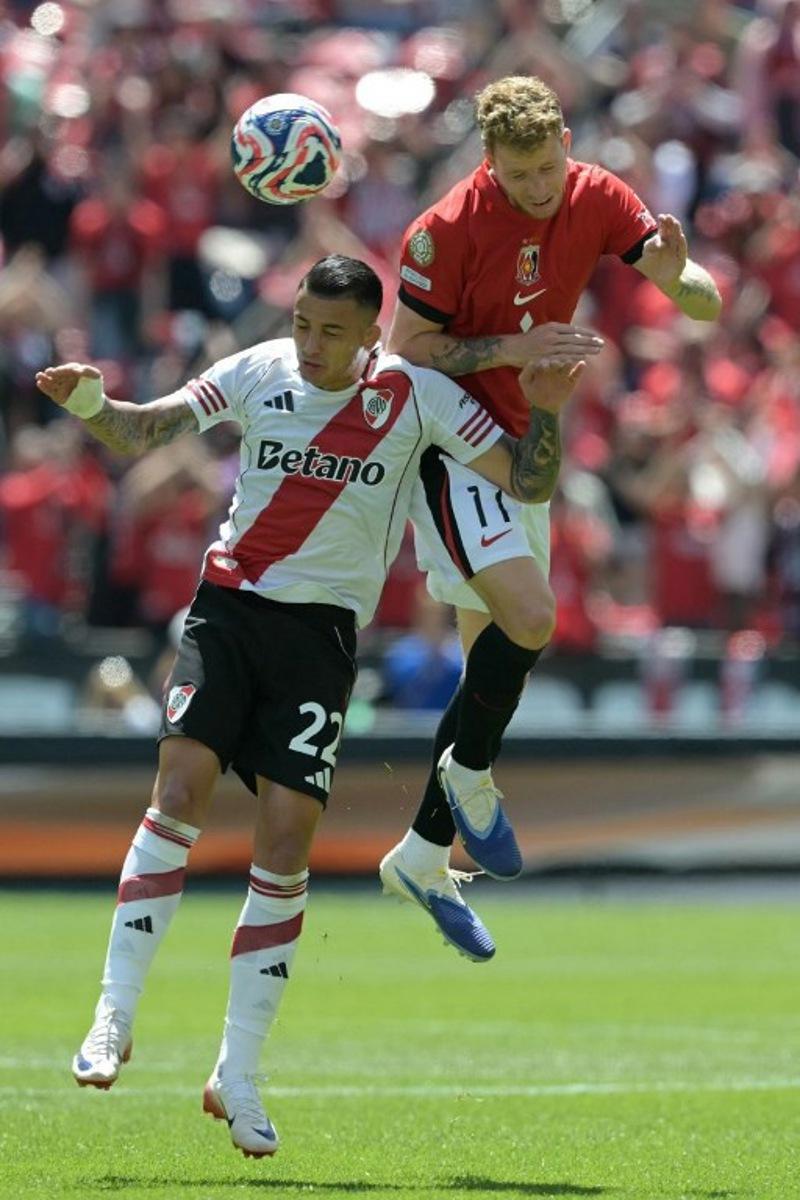 River Plate's Colombian midfielder #22 Kevin Castano and Urawa Red Diamonds' Swedish midfielder #11 Samuel Gustafson fight for the ball during the FIFA Club World Cup 2025 Group E football match between Argentina's River Plate and Japan's Urawa Red Diamonds at the Lumen Field stadium in Seattle on June 17, 2025.  JUAN MABROMATA / AFP