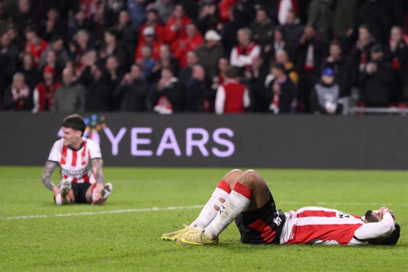 PSV players react at the end of the UEFA Champions League, league phase day 6, football match between PSV Eindhoven (NED) and Atletico Madrid (ESP), at the Philips Stadion, in Eindhoven, south of The Netherlands, on December 9, 2025.  JOHN THYS / AFP