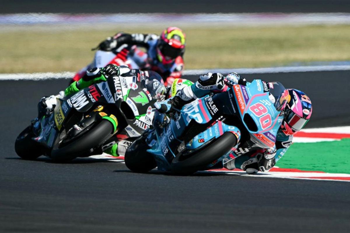 REDS Fantic Racing's Belgian rider Barry Baltus (C) and CFMOTO Aspar European Privilege Team's Colombian rider David Alonso compete during the qualifying session for the Moto2 race as part of the Misano World Circuit Marco Simoncelli, in Misano Adriatico, northern Italy on September 12, 2026.  Andreas SOLARO / AFP