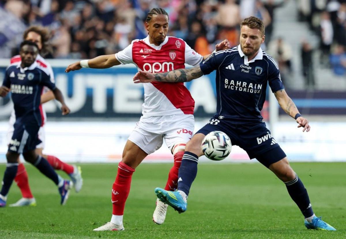 Monaco's German defender #05 Thilo Kehrer (L) fights for the ball with Paris FC's Italian forward #36 Ciro Immobile during the French L1 football match between Paris FC and AS Monaco (ASM) at Stade Jean Bouin in Paris on April 10, 2026.  FRANCK FIFE / AFP