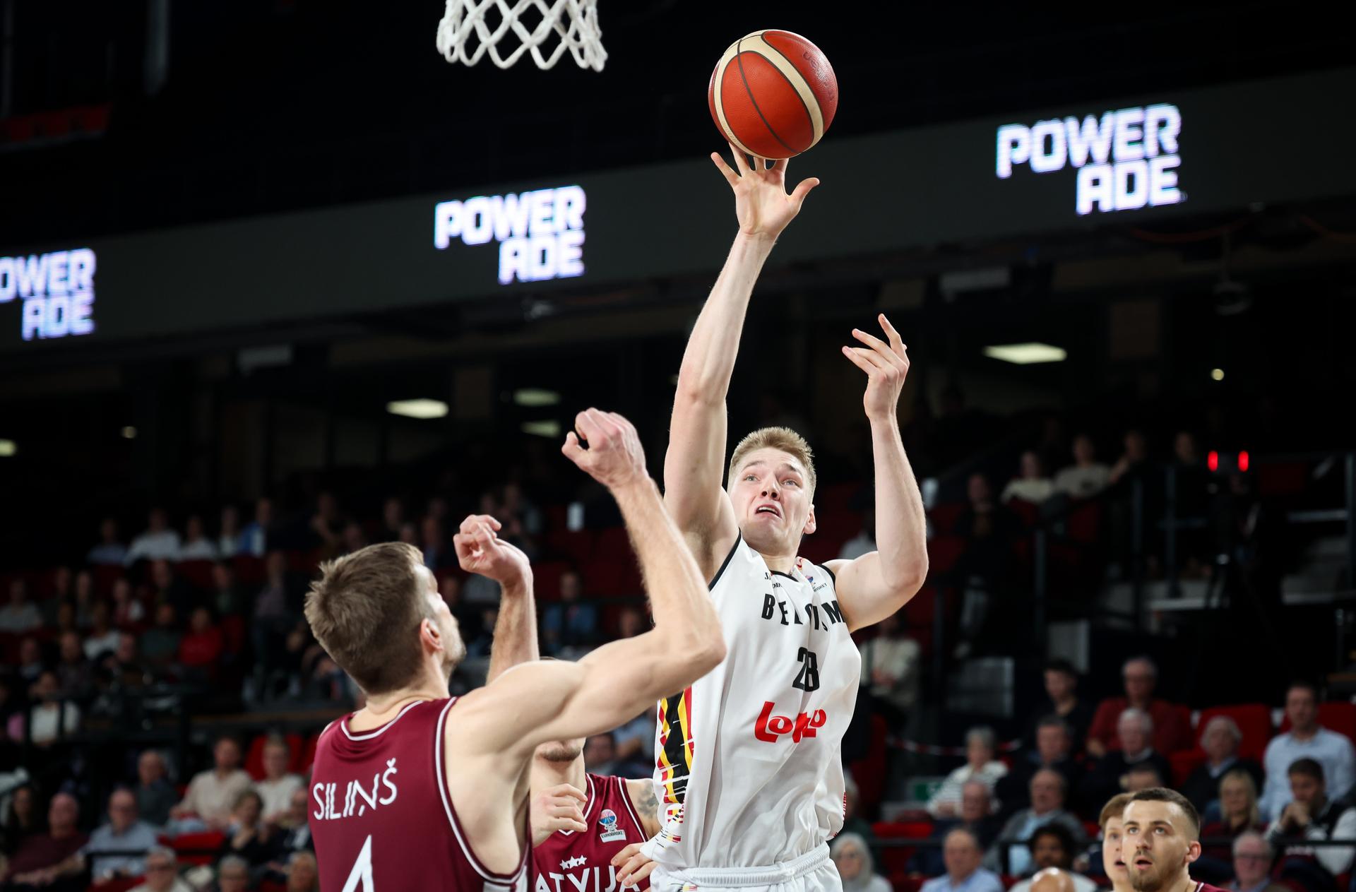 Latvian Ojars Silins and Belgium's Thijs De Ridder fight for the ball during a basketball match between Belgium's national team Belgian Lions and Latvia, Monday 25 November 2024 in Charleroi, game 4/6 in the group stage of the qualifications for the Eurobasket 2025 European championships. BELGA PHOTO VIRGINIE LEFOUR