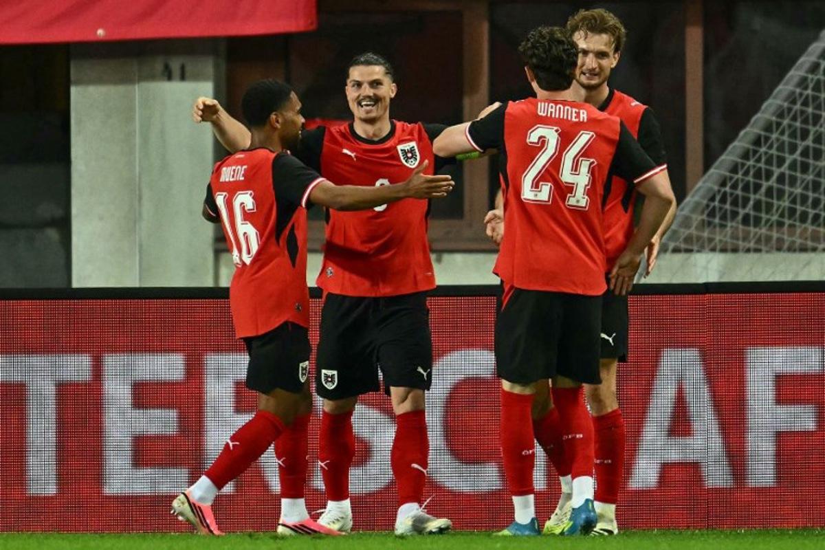 Austria's forward #09 Marcel Sabitzer (2nd L) celebrates scoring the opening goal with his teammates during the friendly football match between Austria and Tunisia in Vienna, Austria on June 1, 2026 ahead of the 2026 FIFA World Cup football tournament.  Joe Klamar / AFP