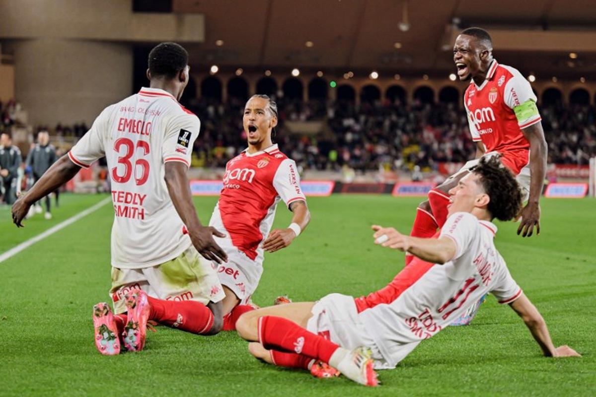 Monaco's Swiss forward #36 Breel Embolo (L), Monaco's German defender #05 Thilo Kehrer (2nd L) Monaco's Swiss midfielder #06 Denis Zakaria (R) and Monaco's French midfielder #11 Maghnes Akliouche (bottom R) celebrate the 2-1 goal during the French L1 football match between AS Monaco and Nice (OGCN) at the Louis II Stadium (Stade Louis II) in the Principality of Monaco on March 29, 2025.  Frederic DIDES / AFP