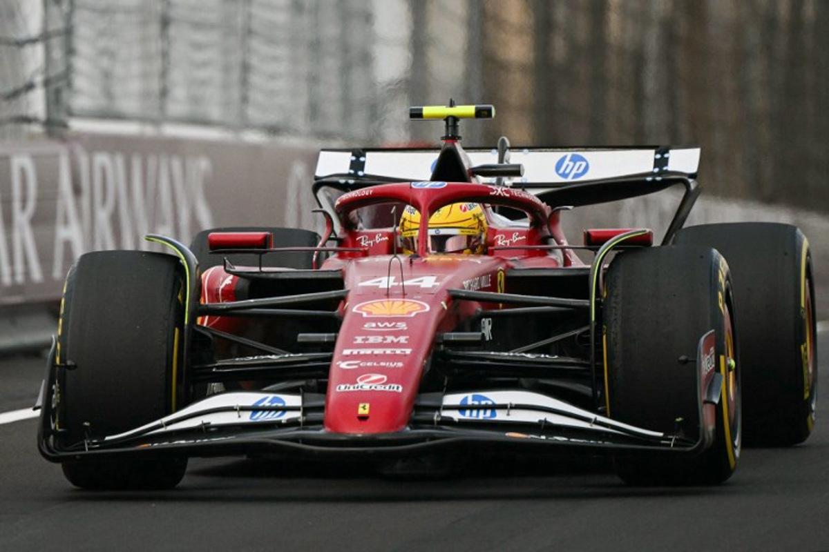 Ferrari's British driver Lewis Hamilton arrives into the pit lane during the Formula One Chinese Grand Prix at the Shanghai International Circuit in Shanghai on March 23, 2025.  Greg Baker / AFP