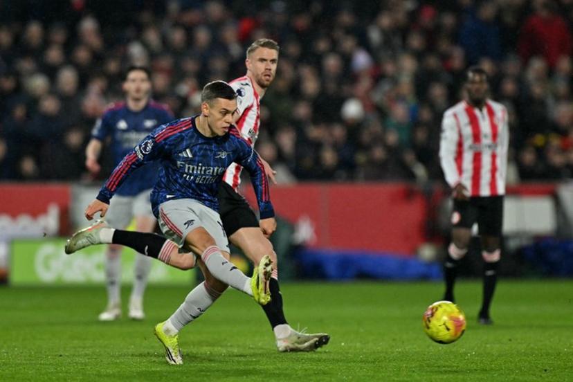 Arsenal's Belgian midfielder #19 Leandro Trossard passes the ball during the English Premier League football match between Brentford and Arsenal at the Gtech Community Stadium in London on February 12, 2026.  Glyn KIRK / AFP