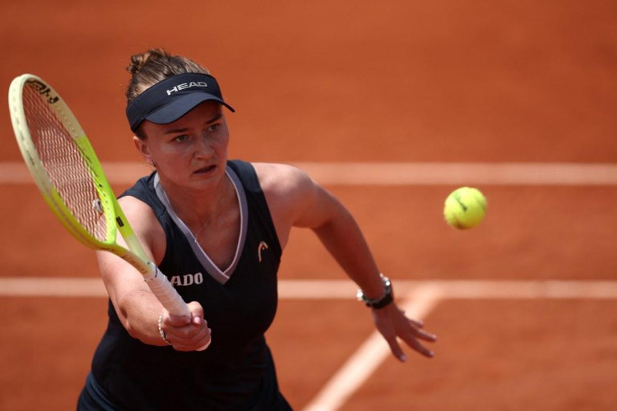 Czech Republic's Barbora Krejcikova plays a backhand return to Russia's Veronika Kudermetova during their women's singles match on day 5 of the French Open tennis tournament at the Roland-Garros Complex in Paris on May 29, 2025.  Anne-Christine POUJOULAT / AFP