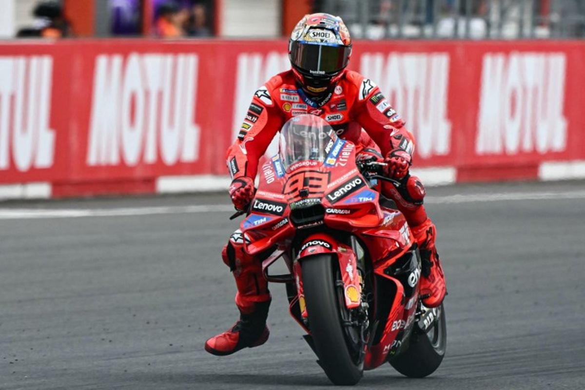 Ducati Lenovo Team's Spanish MotoGP rider Marc Marquez competes in the MotoGP class race of the MotoGP Japanese Grand Prix at the Mobility Resort Motegi in Motegi, Tochigi prefecture on September 28, 2025.  Toshifumi KITAMURA / AFP