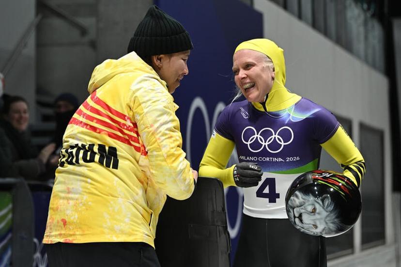 Kim Meylemans (r) of Belgium reacts after completing a run in the Women's Skeleton Heat 3 on day eight of the Milano Cortina 2026 Winter Olympic Games at Cortina Sliding Centre, Cortina d'Aprezzo, Italy, February 14, 2026. (Photo by Anthony Behar/Sipa USA) BELGIUM ONLY