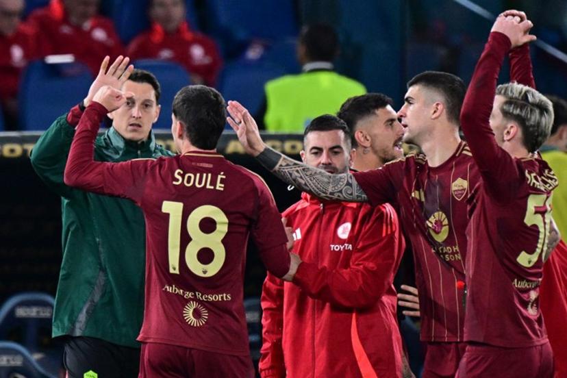 Roma's Argentine forward #18 Matias Soule celebrates scoring his team's first goal during the Italian Serie A football match between Lazio and Roma at the Olympic Stadium in Rome on April 13, 2025.  Tiziana FABI / AFP