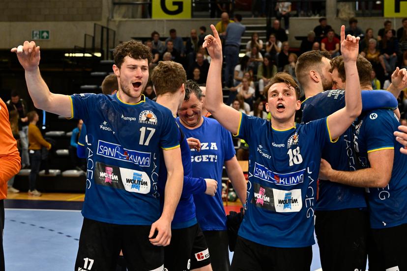 Bocholt's Joren Lamers and Bocholt's Thomas Driesen celebrate after winning a game between Achilles Bocholt and Sporting Pelt, the men's final of the Belgian handball cup, Saturday 01 April 2023, in Hasselt. BELGA PHOTO JOHAN EYCKENS