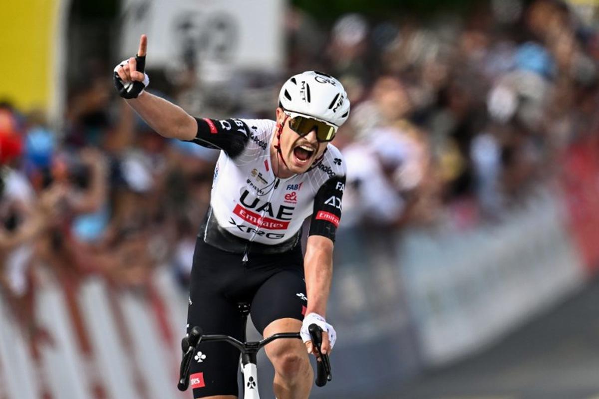Australia's Jay Vine celebrates winning the third stage of the Tour of Romandie UCI cycling World tour, 183.1 km loop from the start to the finish in Cossonay, near Vullierens on May 2, 2025.  Fabrice COFFRINI / AFP