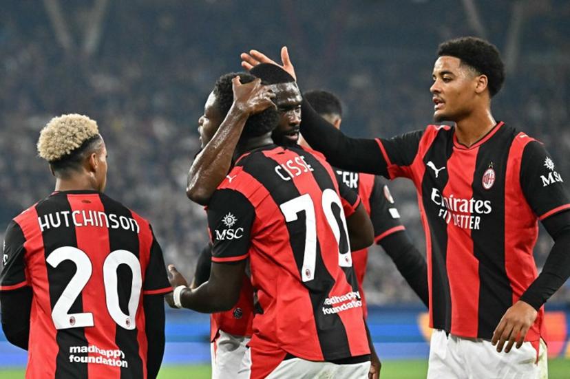 AC Milan's Italian midfielder #70 Alphadjo Cisse (C) celebrates with teammates scoring the opening goal during the UEFA Europa League football match between Salzburg and AC Milan in Salzburg, on October 15, 2026.  Joe Klamar / AFP