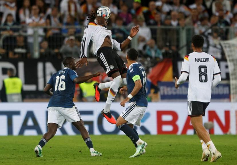 Germany's defender #02 Yann Aurel Bisseck heads the ball during the UEFA Nations League Group A2 between Germany and Greece in Augsburg, southern Germany on September 27, 2026.  Michaela STACHE / AFP