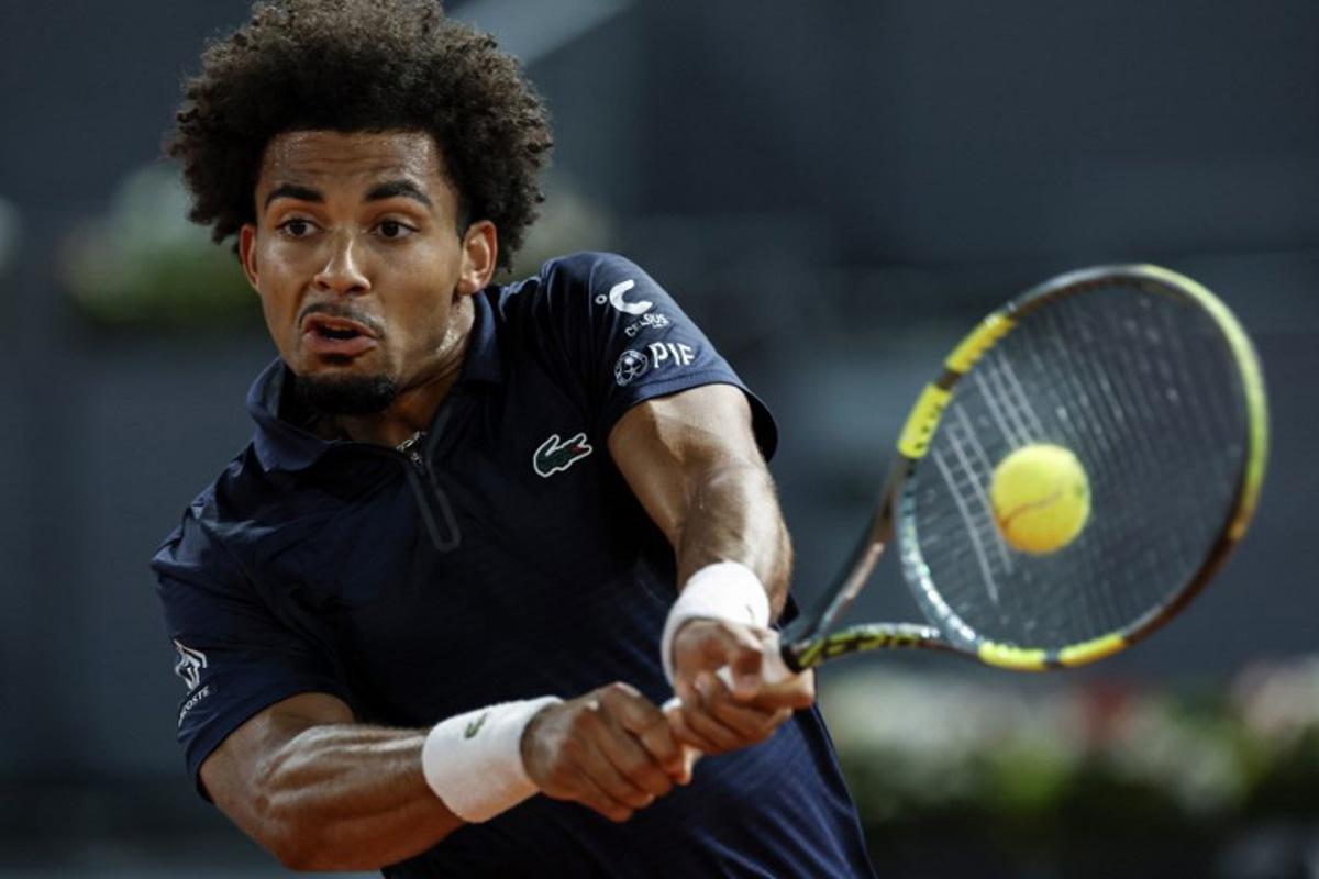France's Arthur Fils returns the ball to Czech Republic's Jiri Lehecka during their 2026 ATP Tour Madrid Open tennis tournament quarterfinal singles match at the Caja Magica in Madrid, on April 29, 2026.  OSCAR DEL POZO / AFP